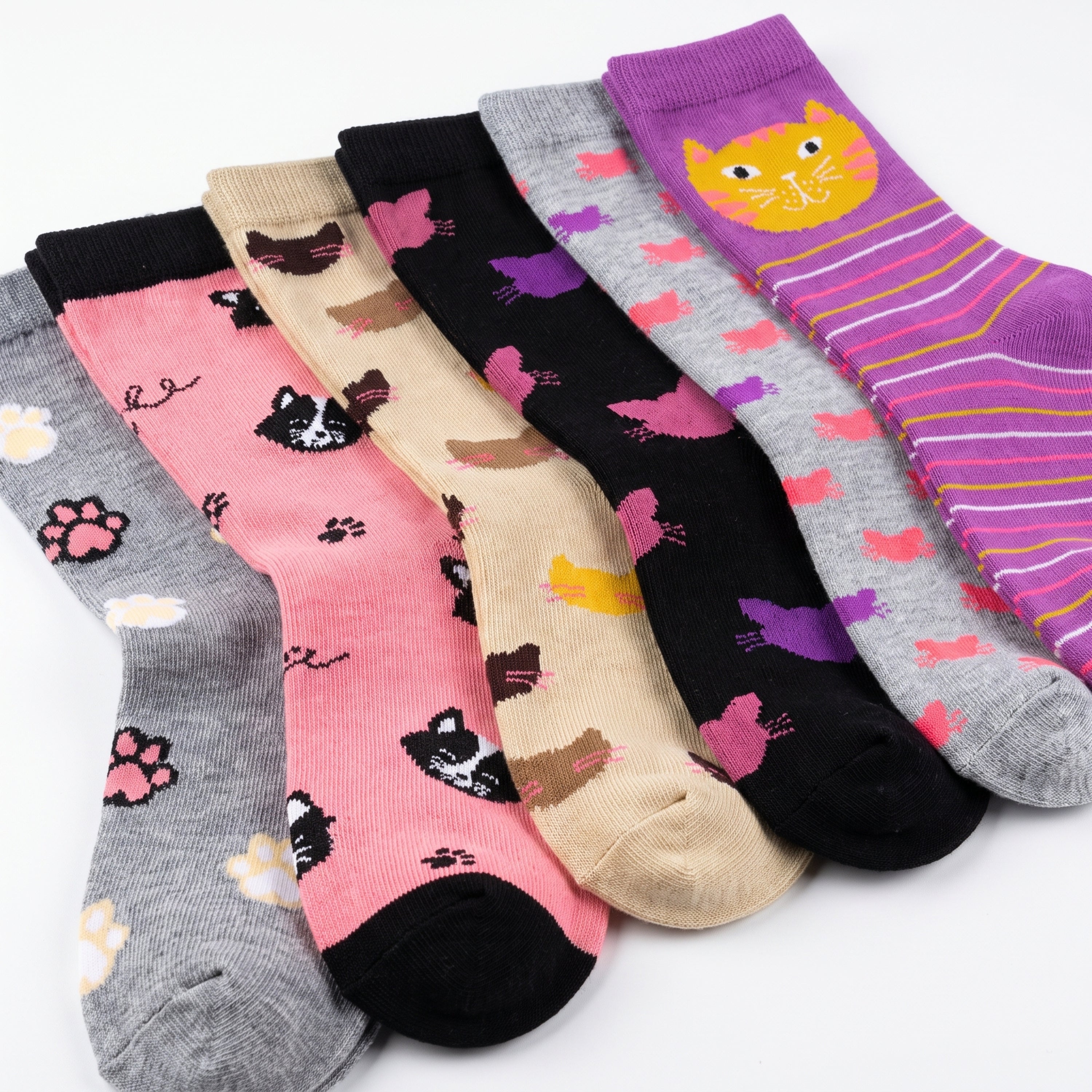 Five pairs of patterned crew socks arranged overlapping on a white background. The socks feature various colorful prints including cat faces, hearts, paw prints, stripes, and abstract shapes in pink, gray, black, beige, and purple.