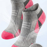 Gray and pink socks with breathable mesh ventilation on a light gray background