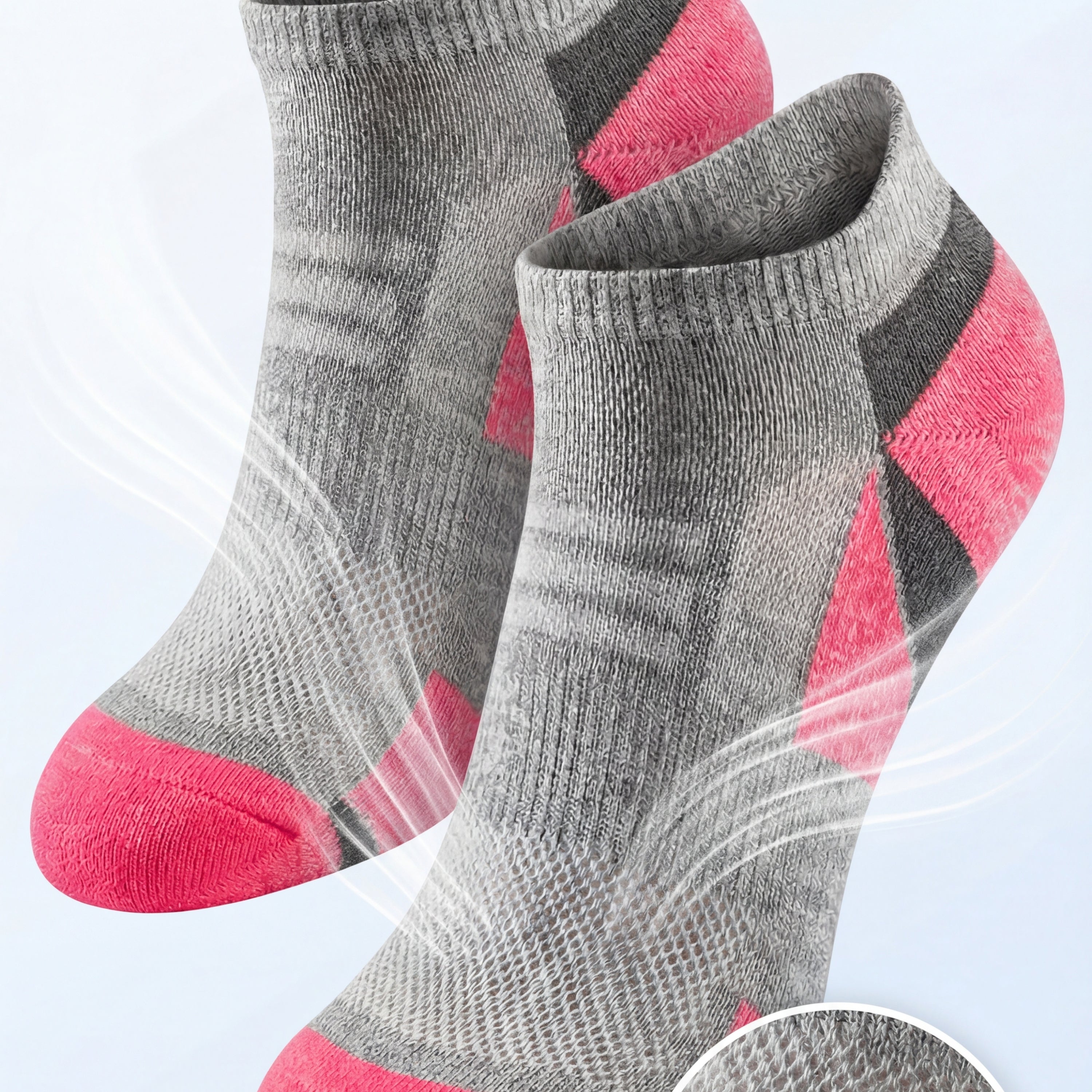 Gray and pink socks with breathable mesh ventilation on a light gray background