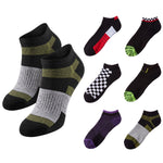 A set of eight low-cut athletic socks displayed on a clean white background, featuring various colorways including black, gray, olive green, red, purple, and checkered patterns.