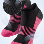Black and pink socks with breathable mesh design on a light gray background