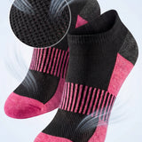 Black and pink socks with breathable mesh design on a light gray background