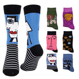 A set of nine crew socks displayed on a plain white background, featuring various colorful graphic designs including stylized faces, stripes, and abstract patterns.