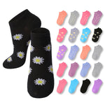 Black socks with white daisy patterns on a white background, surrounded by colorful socks.