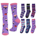 A set of eight crew socks displayed on a plain white background, featuring various colorful patterns including purple cake prints, stripes, and geometric shapes.