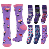 A set of eight crew socks displayed on a plain white background, featuring various colorful patterns including purple cake prints, stripes, and geometric shapes.