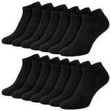 Multiple pairs of black ankle socks on a white background