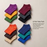 Set of colorful ankle socks arranged in a pyramid formation on a beige background.