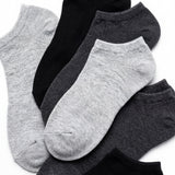 Set of gray and black ankle socks on a white background