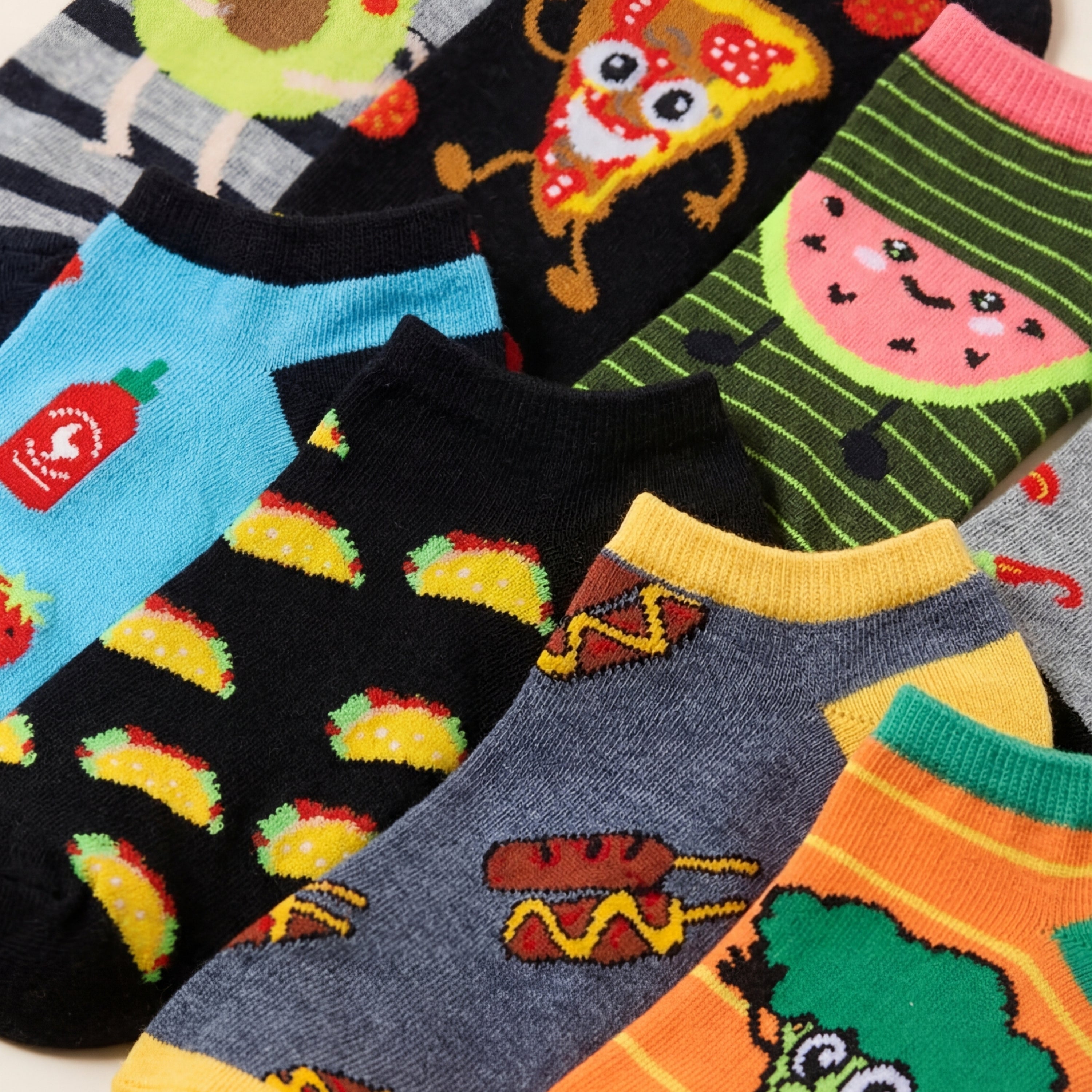 Collection of colorful socks with various patterns on a white background