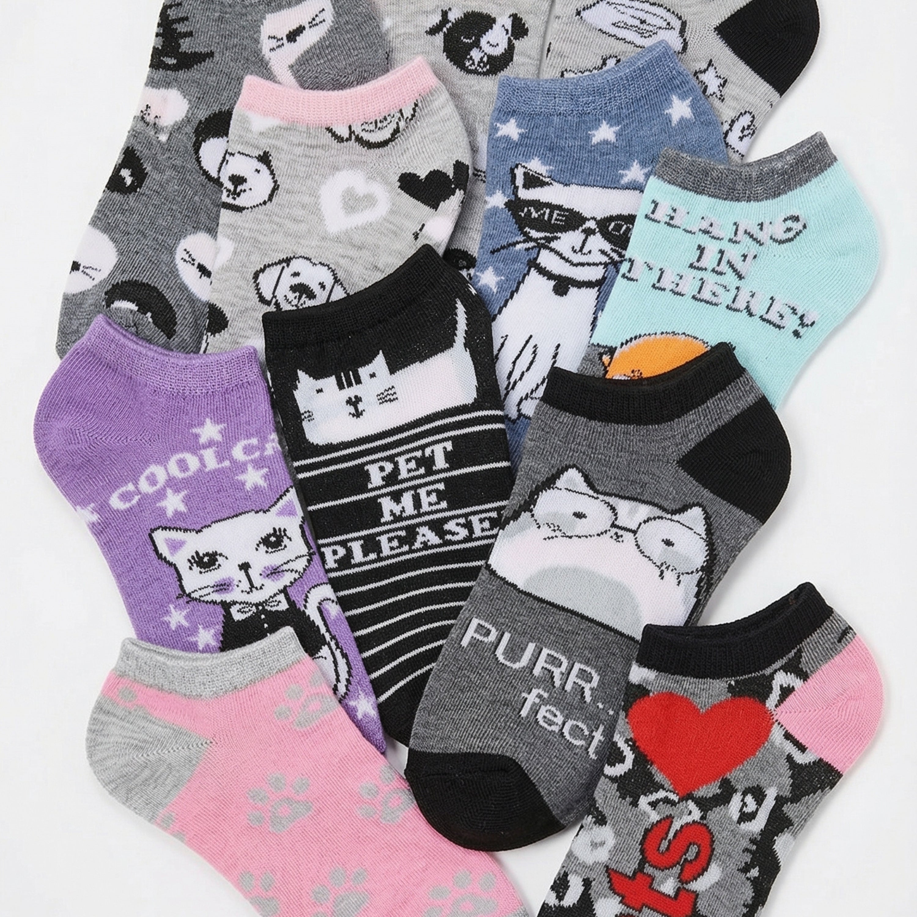 Collection of cat-themed socks with various designs on a white background