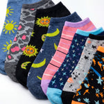 Assorted colorful socks with various patterns on a white background