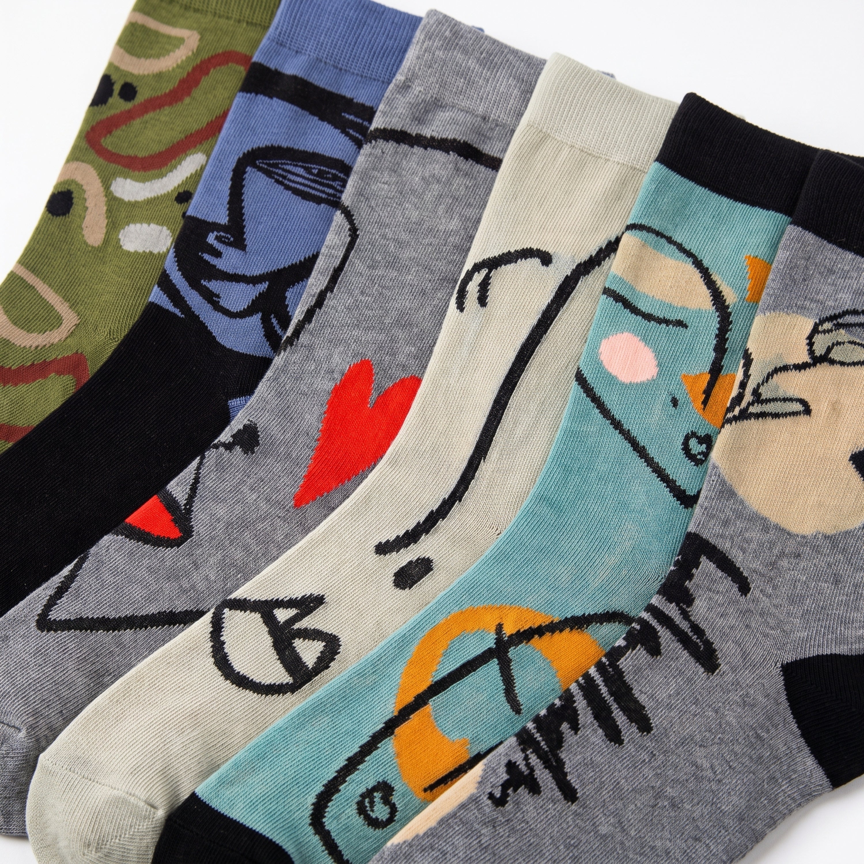 Five pairs of patterned crew socks arranged overlapping on a white background. The socks feature abstract cartoon-style illustrations in different colors and patterns, including olive green, blue, light gray, teal, and heather gray.
