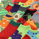 Collection of colorful socks with fruit designs.