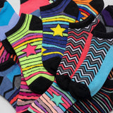 Colorful patterned socks with stars and zigzag designs on a white background