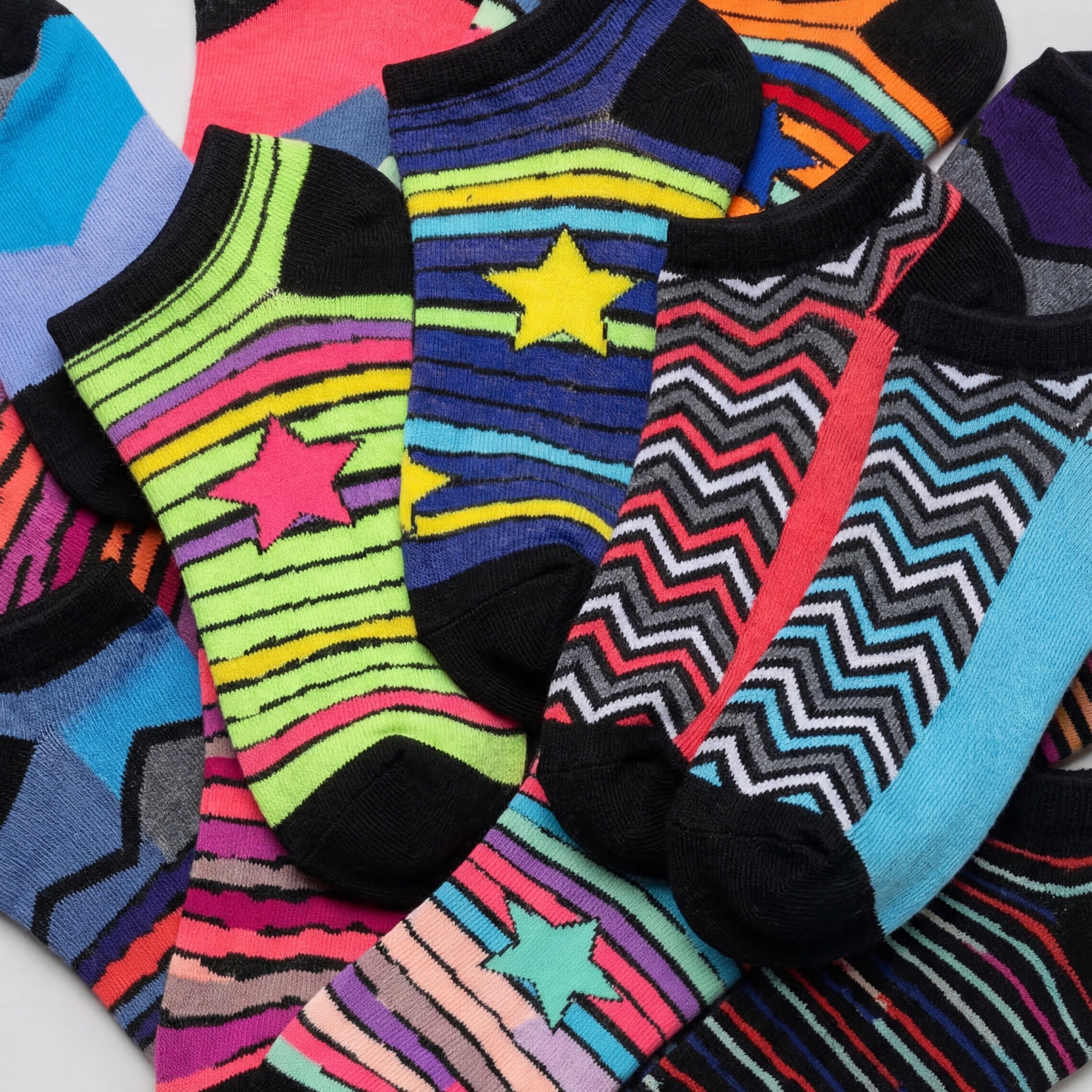 Colorful patterned socks with stars and zigzag designs on a white background