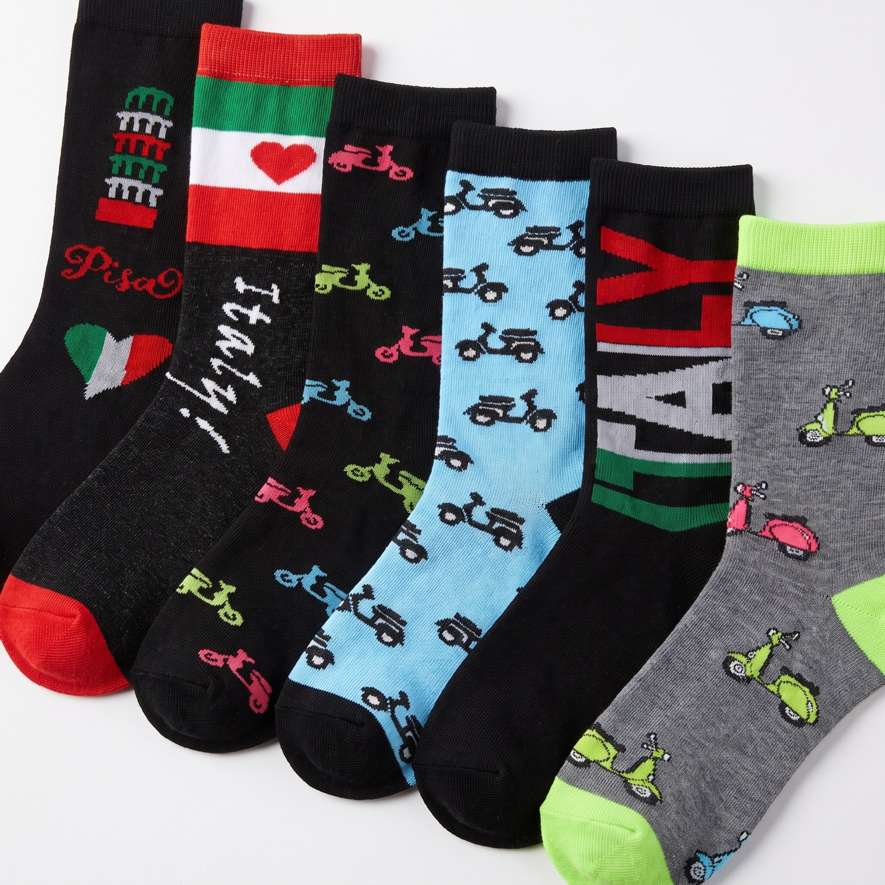 Six pairs of novelty socks with Italian-themed designs, including flags, text, and scooter patterns, arranged diagonally on a white background.