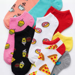 Collection of colorful socks with food-themed designs on a white background