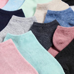 Assorted colorful socks arranged in a row