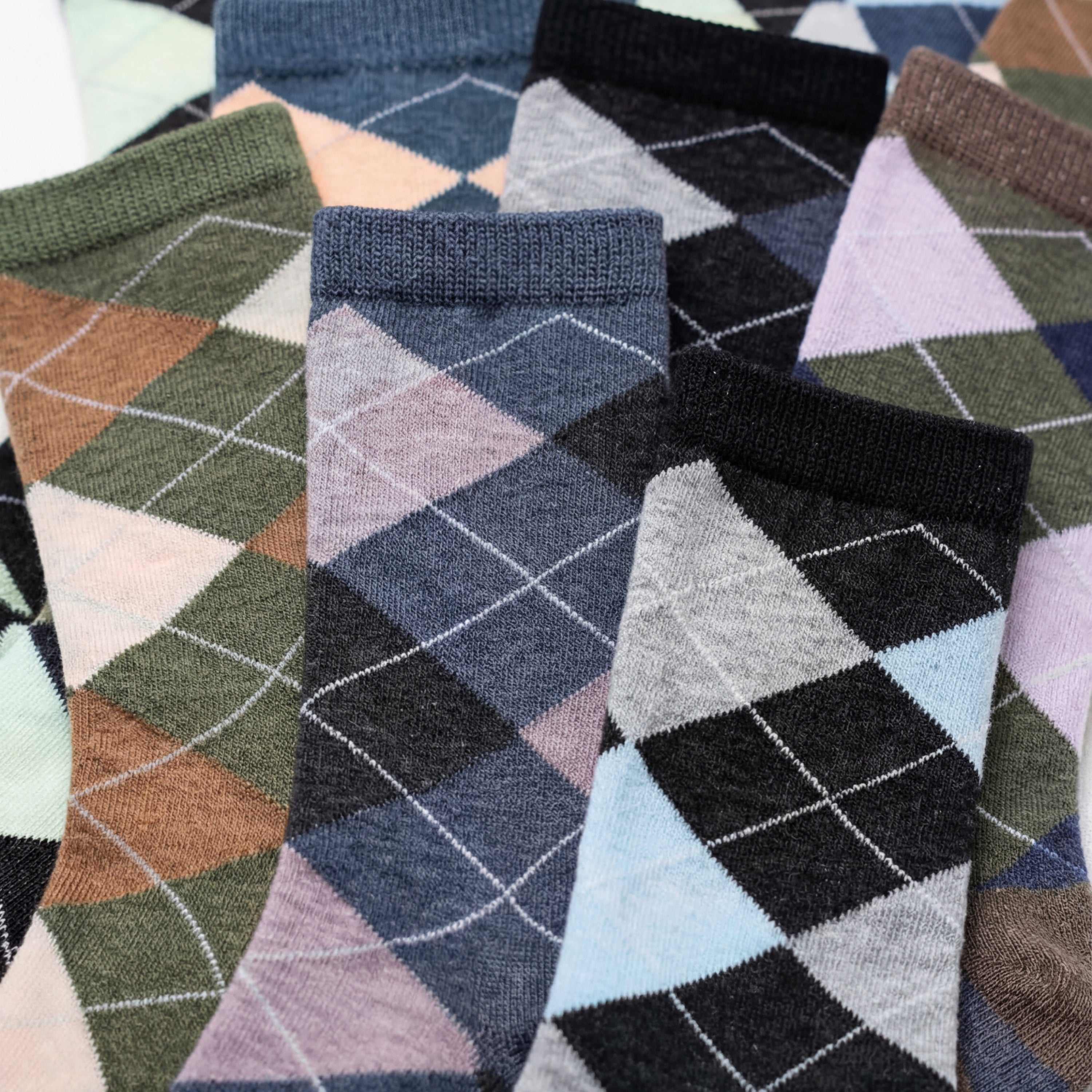 Collection of patterned socks with geometric designs in various colors.