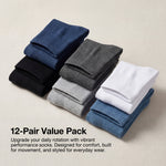 Stack of 12 pairs of socks in various colors on a beige background