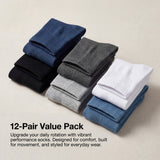 Stack of 12 pairs of socks in various colors on a beige background