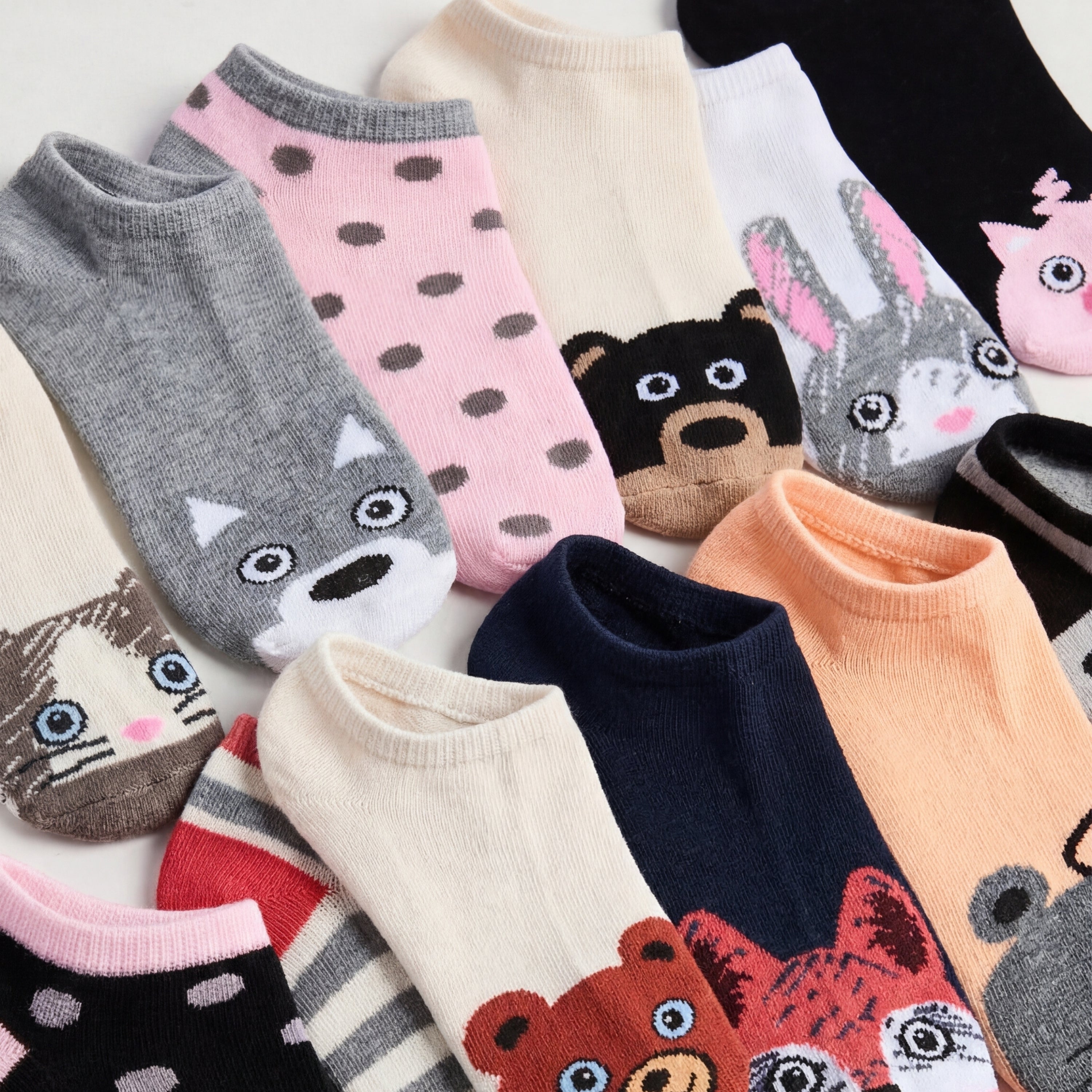 Collection of colorful socks with animal designs on a white background