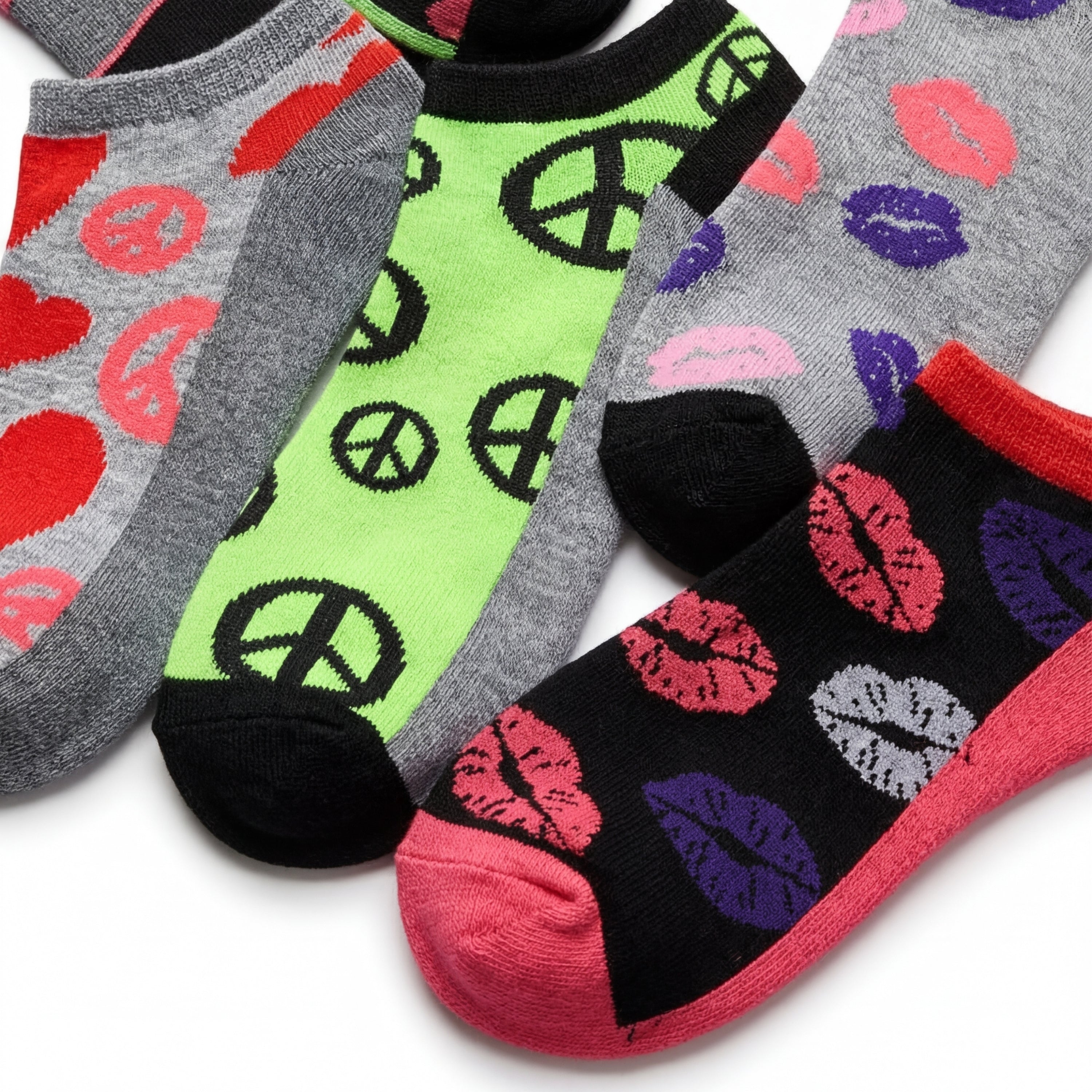 Four pairs of socks with different patterns on a white background