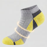 Gray and yellow sock with targeted arch support on a light gray background