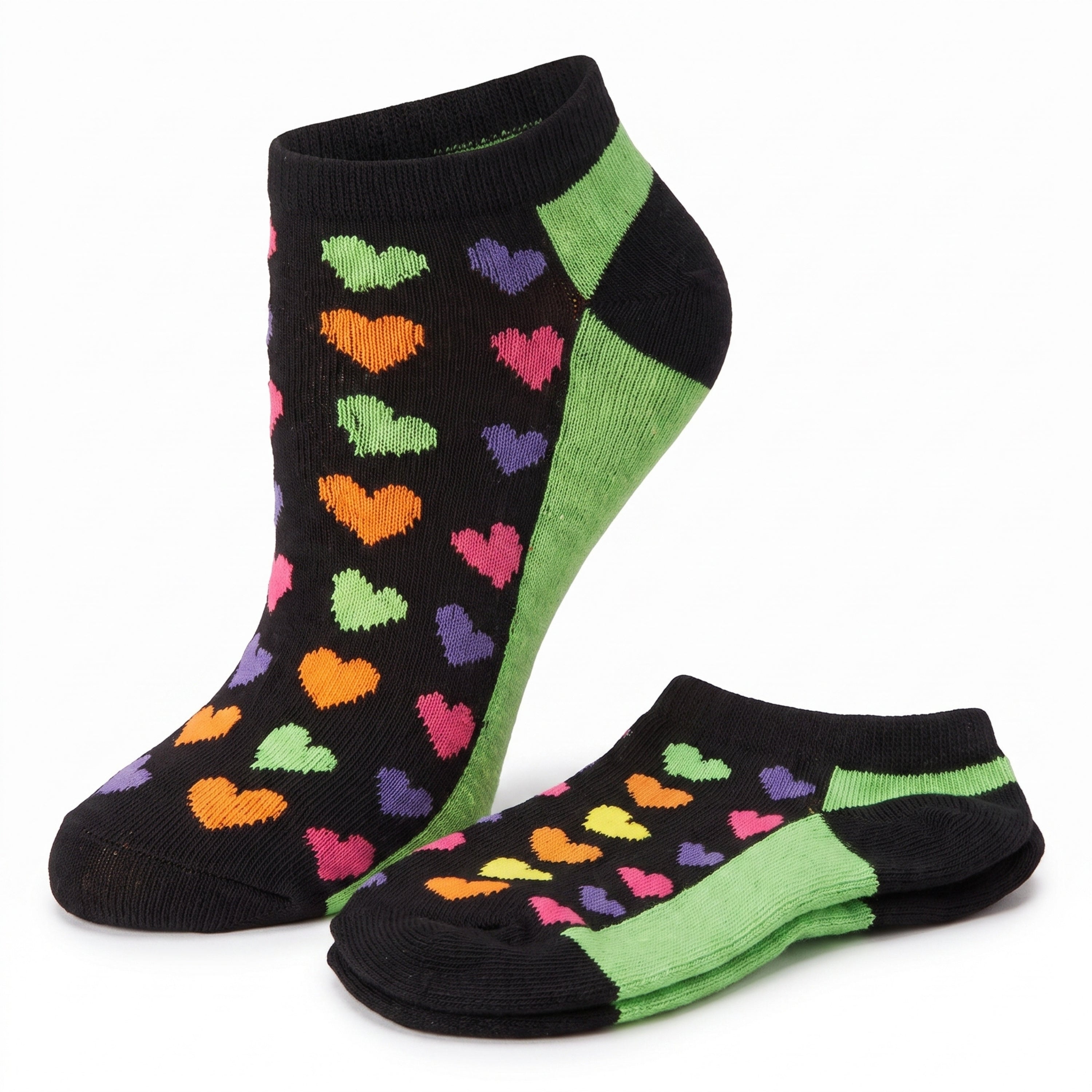 A pair of low-cut ankle socks on a white background. The socks are black with a pattern of small colorful hearts in green, orange, pink, and purple, and feature bright green side panels.