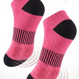 Pink socks with black accents on a white background, emphasizing cushioned sole comfort.