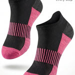 Black and pink socks with cushioned sole on a white background