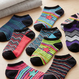 Colorful socks with patterns on a wooden floor