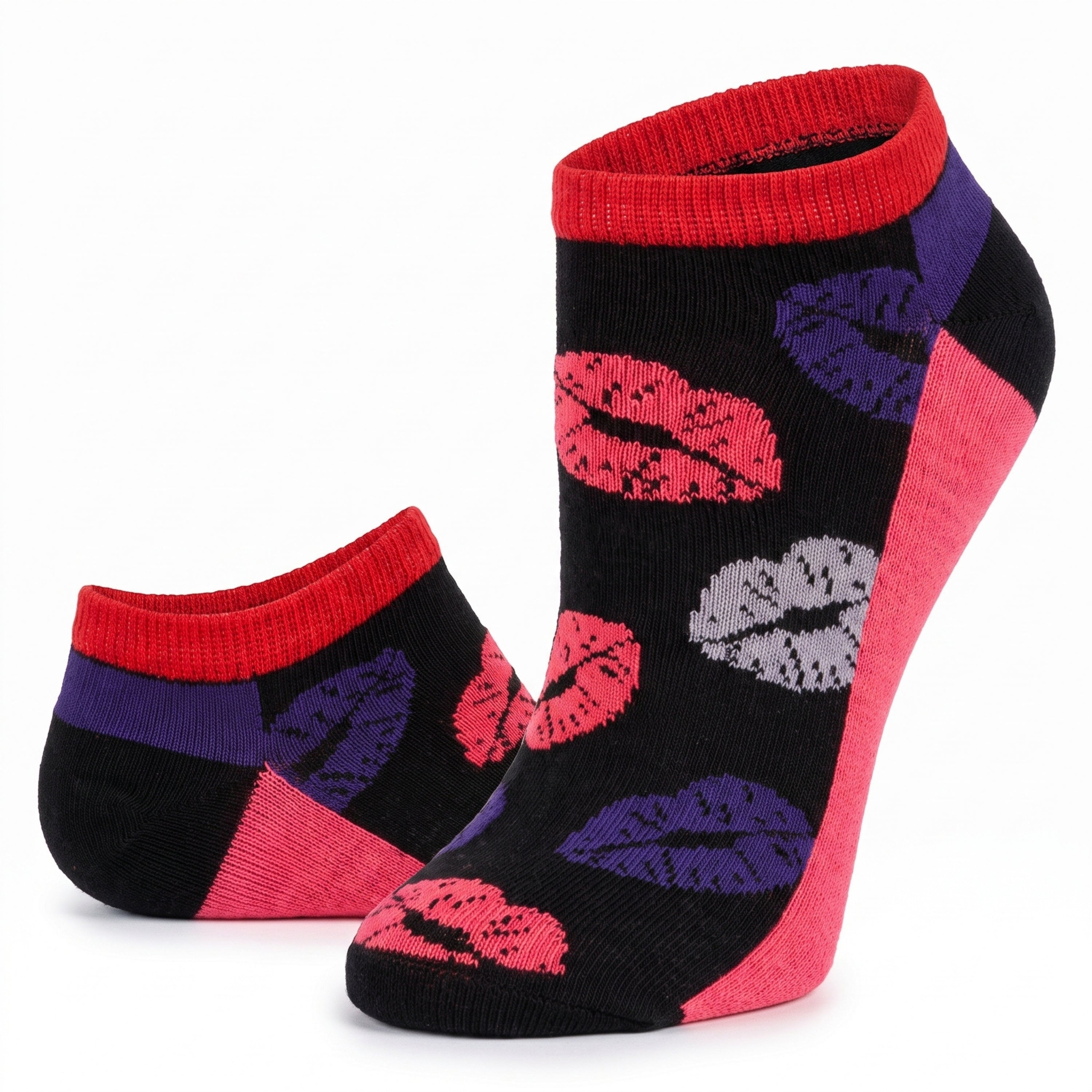 A pair of low-cut ankle socks on a white background. The socks feature a black knit base with a pattern of red, pink, purple, and gray lipstick kiss marks, accented with red ribbed cuffs, purple side panels, and pink heels.