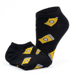 A pair of low-cut black socks with a repeating yellow and gray geometric pattern, displayed on a clean white background.