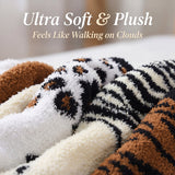 Plush tiger-patterned blanket with text 'Ultra Soft & Plush Feels Like Walking on Clouds' on a blurred background.