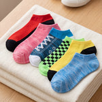 Set of colorful socks on a textured surface