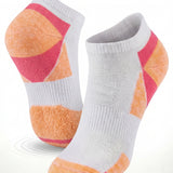 Pair of socks with orange and pink accents on a white background