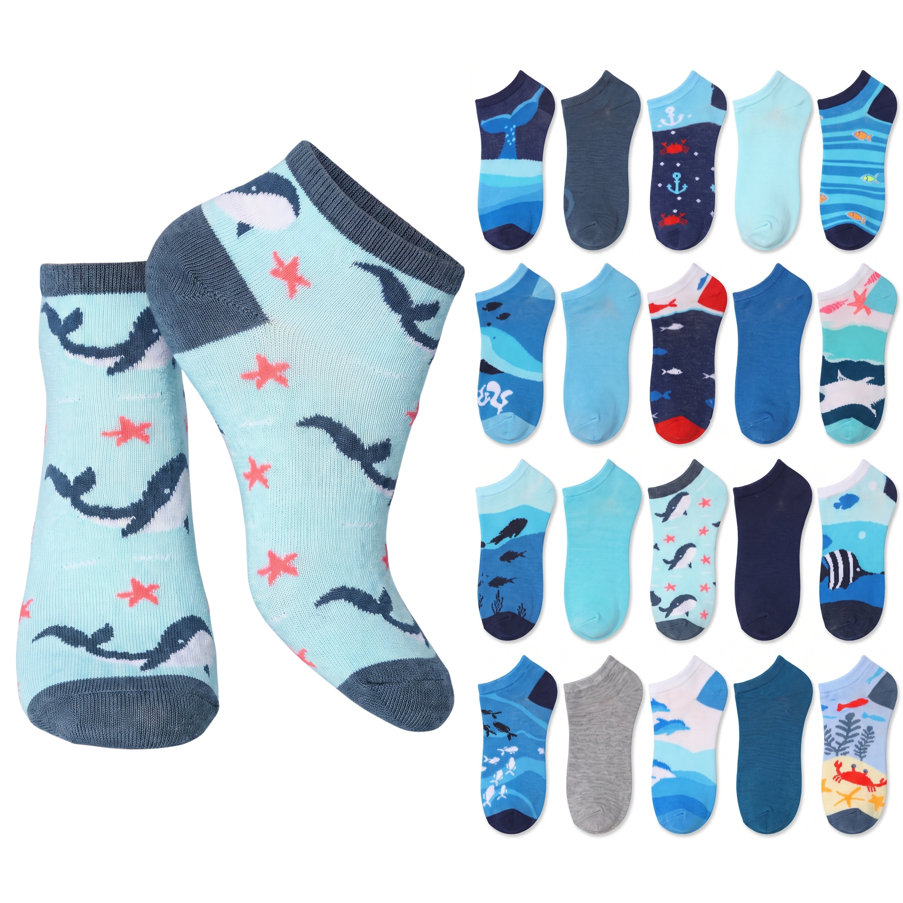 A set of children's ankle socks shown on a white background, featuring a large pair on the left in a light blue ocean-themed print with dark blue whales and coral, and a grid of 16 smaller sock designs on the right showing various patterns and colors.