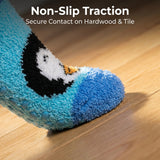 Blue cartoon penguin slipper on a wooden floor with text about non-slip traction.