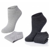 Two pairs of gray and black ankle socks on a white background