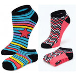 Colorful striped and zigzag patterned socks on a white background