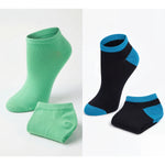 Two pairs of socks, one green and one black with blue accents, on a white background.