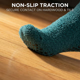 Blue textured sock on a wooden floor with text 'Non-Slip Traction' and 'Secure Contact on Hardwood & Tile'.