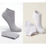 Gray and white ankle socks on a light background