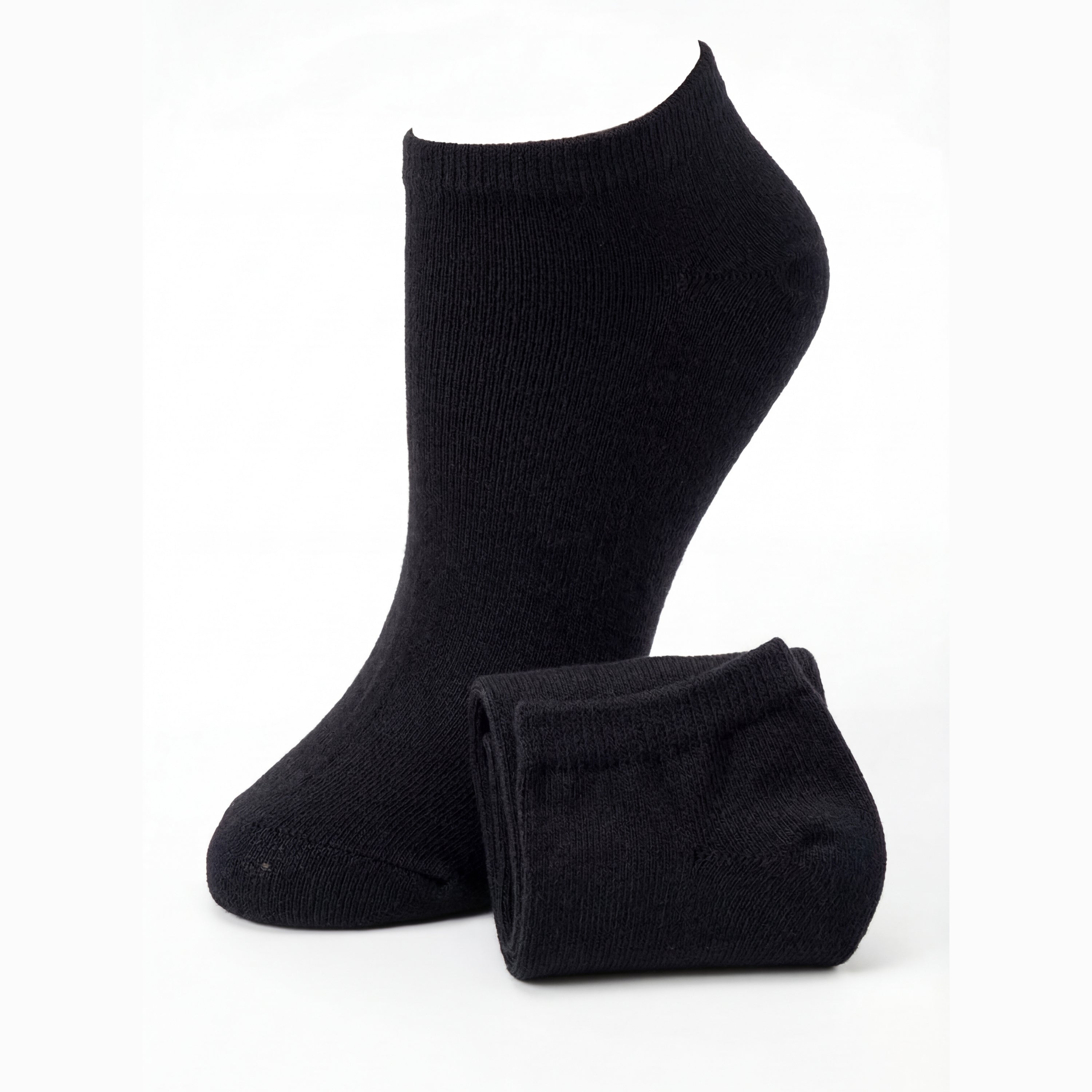 Pair of black ankle socks on a white background
