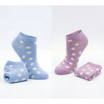 Two pairs of socks, one blue and one purple, with daisy patterns on a white background.