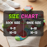 Colorful socks with a size chart overlay on a wooden surface