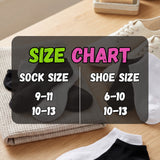 Size chart for socks and shoes on a wooden surface with black socks and white shoes.