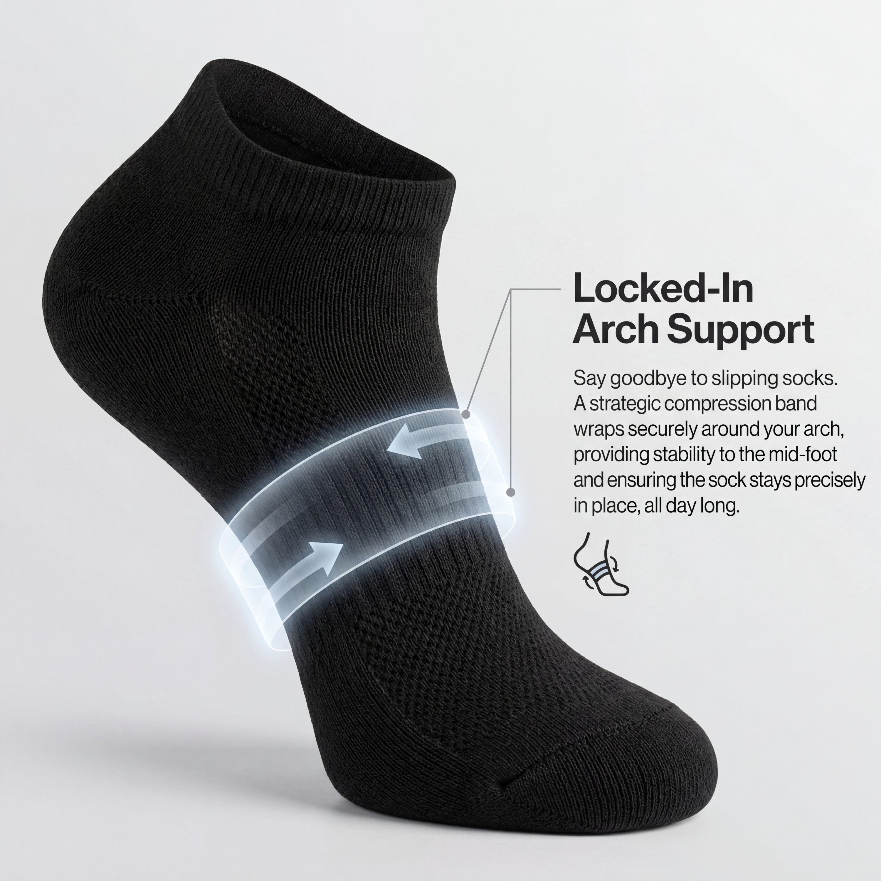 Black ankle sock with arch support feature on a light gray background